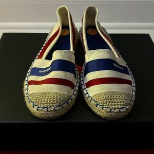 White, blue, and red Nautica shoes